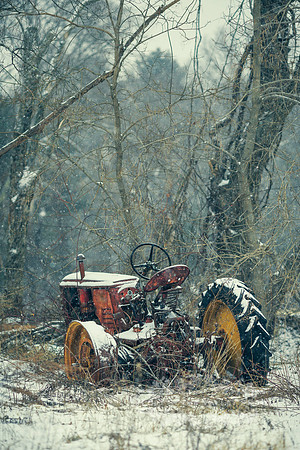"Abandoned Tractor in Snow"