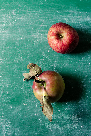 Two Red Apples on Table
